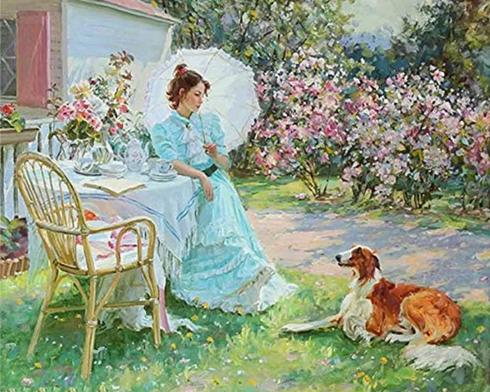 Broderie diamant femme et chien dans un jardin fleuri